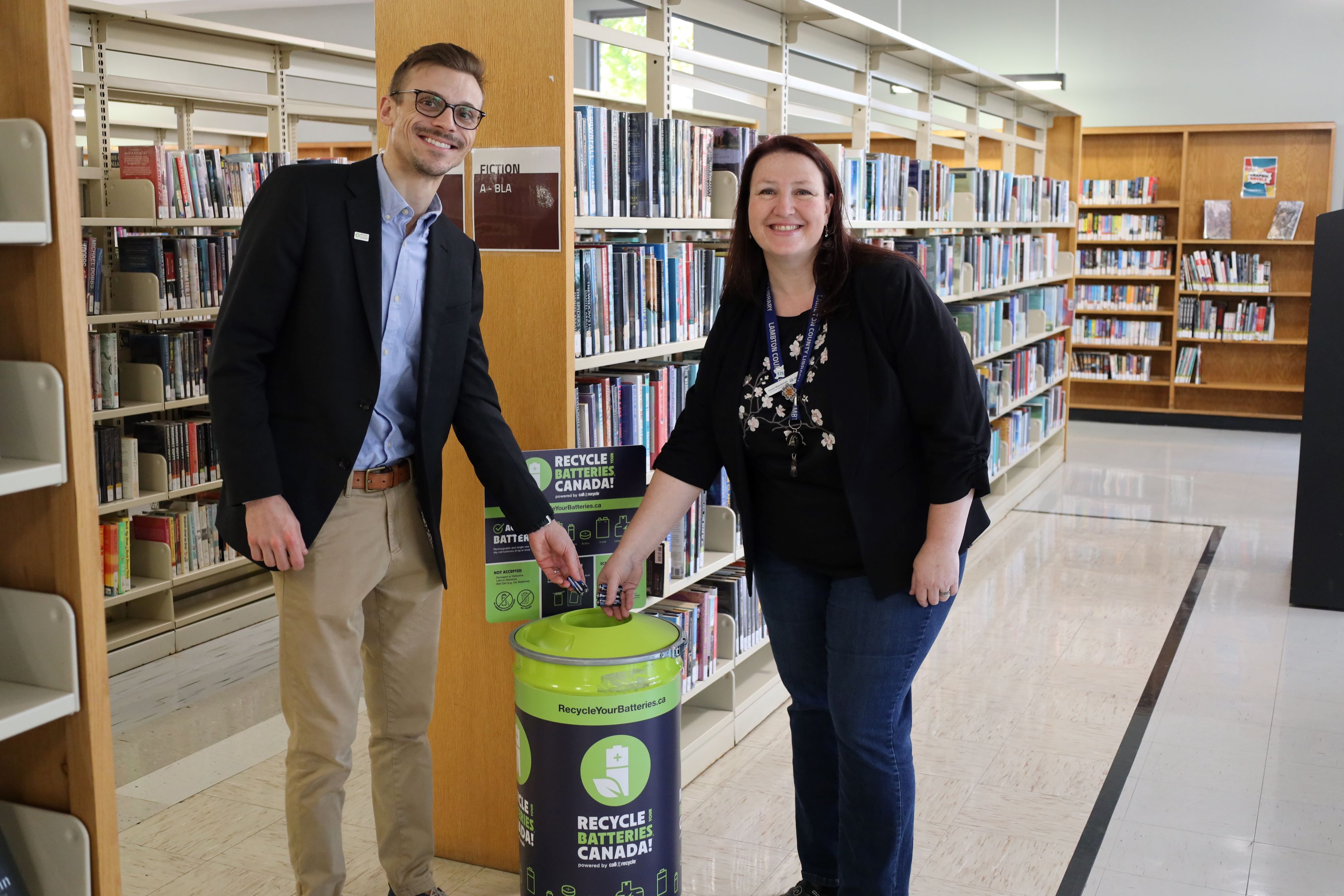 Steve Gauthier, Key Account Manager, Call2Recycle Canada and Greer Macdonell, Community Library Supervisor, Lambton County Library recycle batteries at Sarnia Library. 